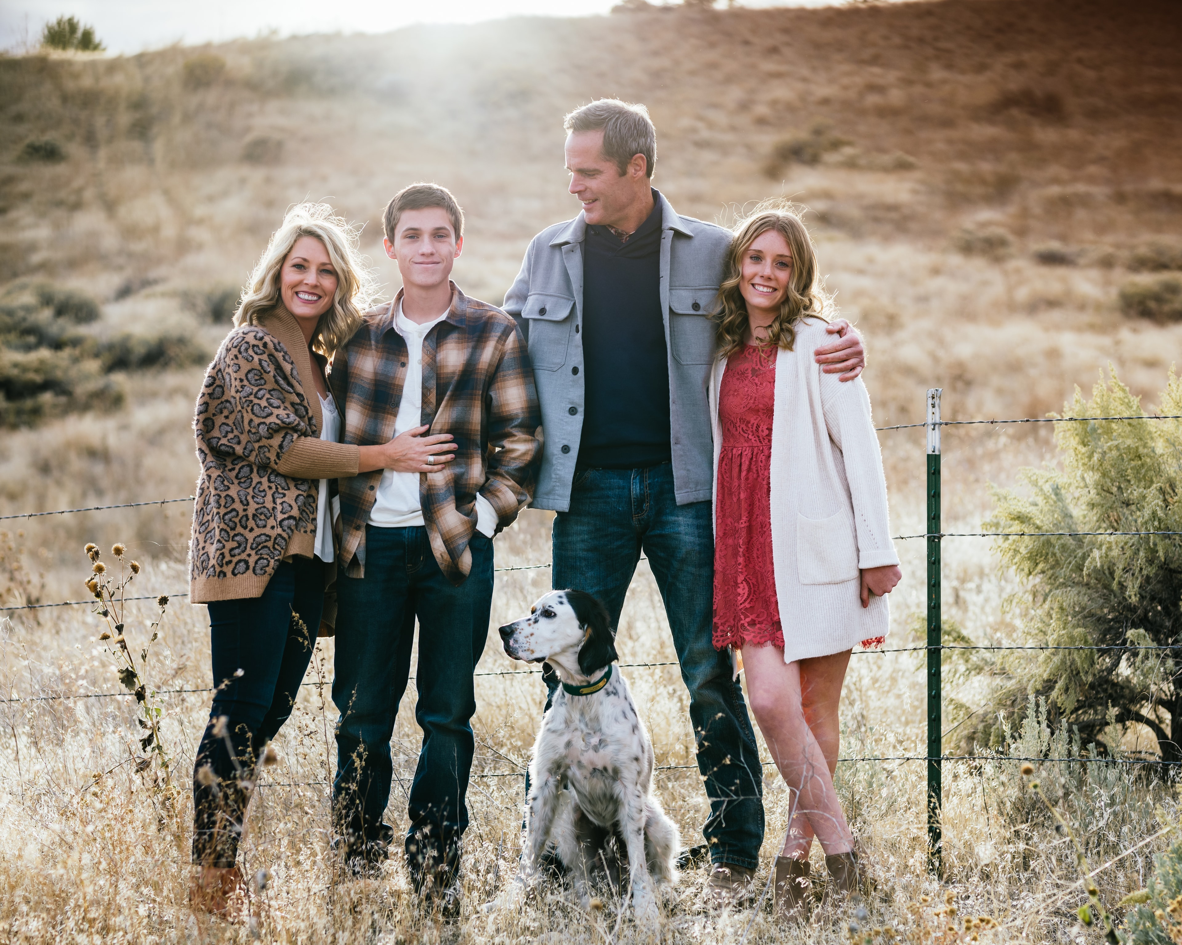 Family of four in autumn woods — Treasure Valley fall family portraits