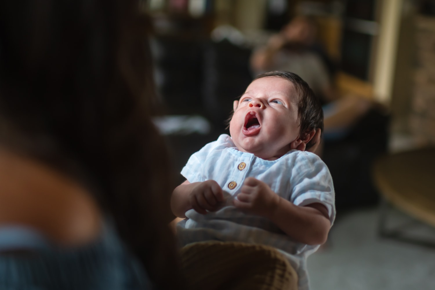 Baby yawning in soft natural light — newborn family photography Treasure Valley