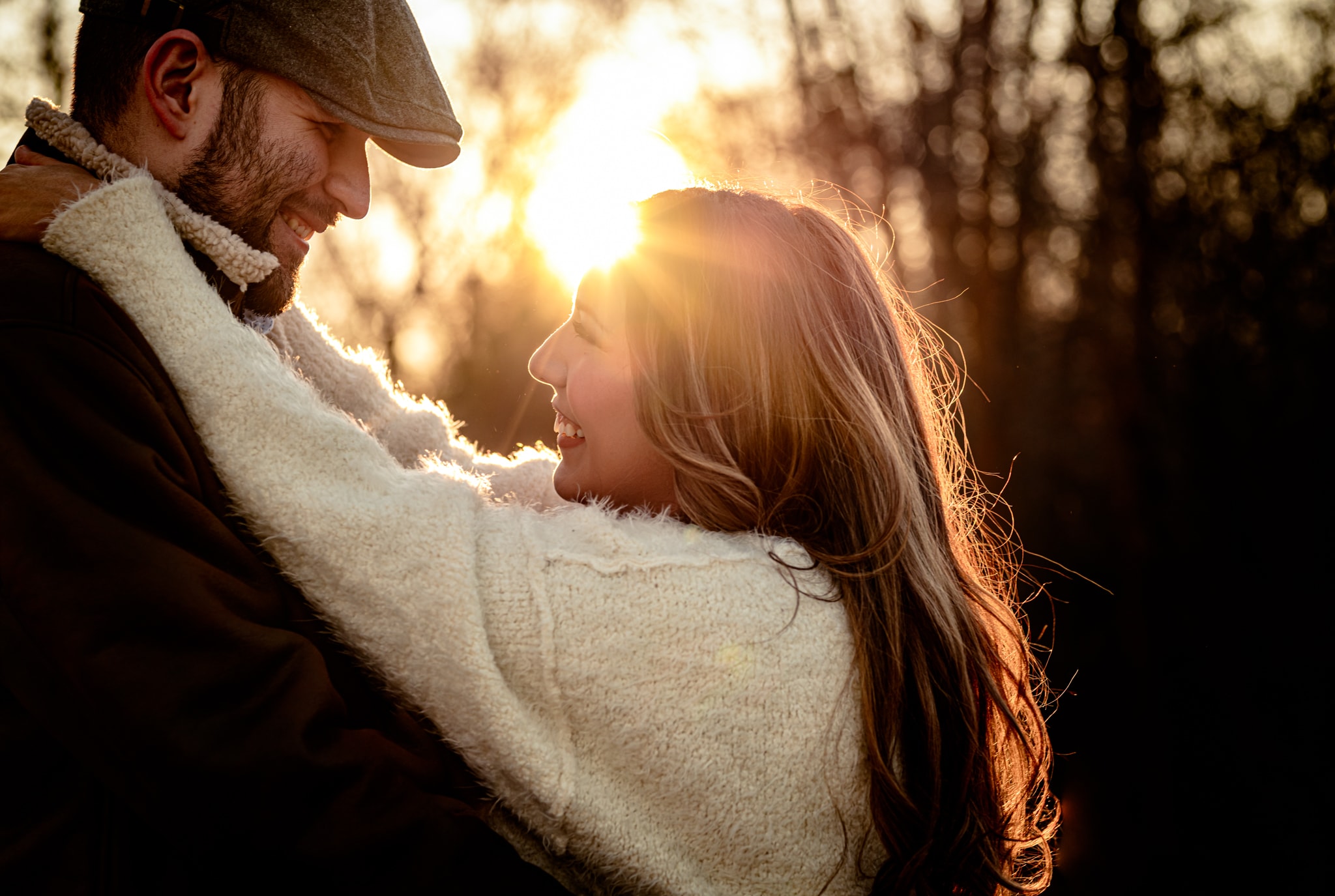 Couple embracing in golden sunset light — Treasure Valley family photography