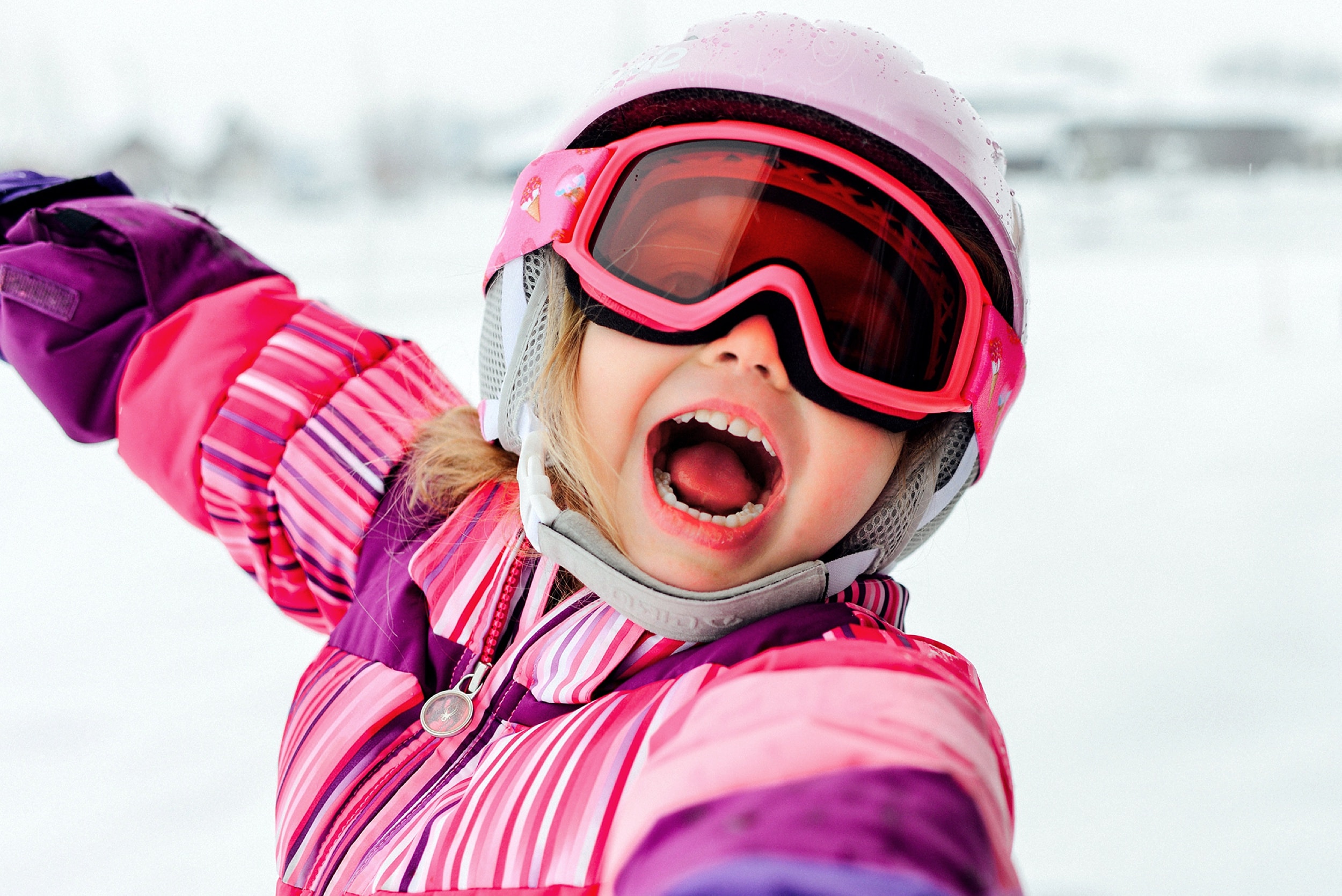 Child skiing in pink winter gear — IdaHOPE community photography