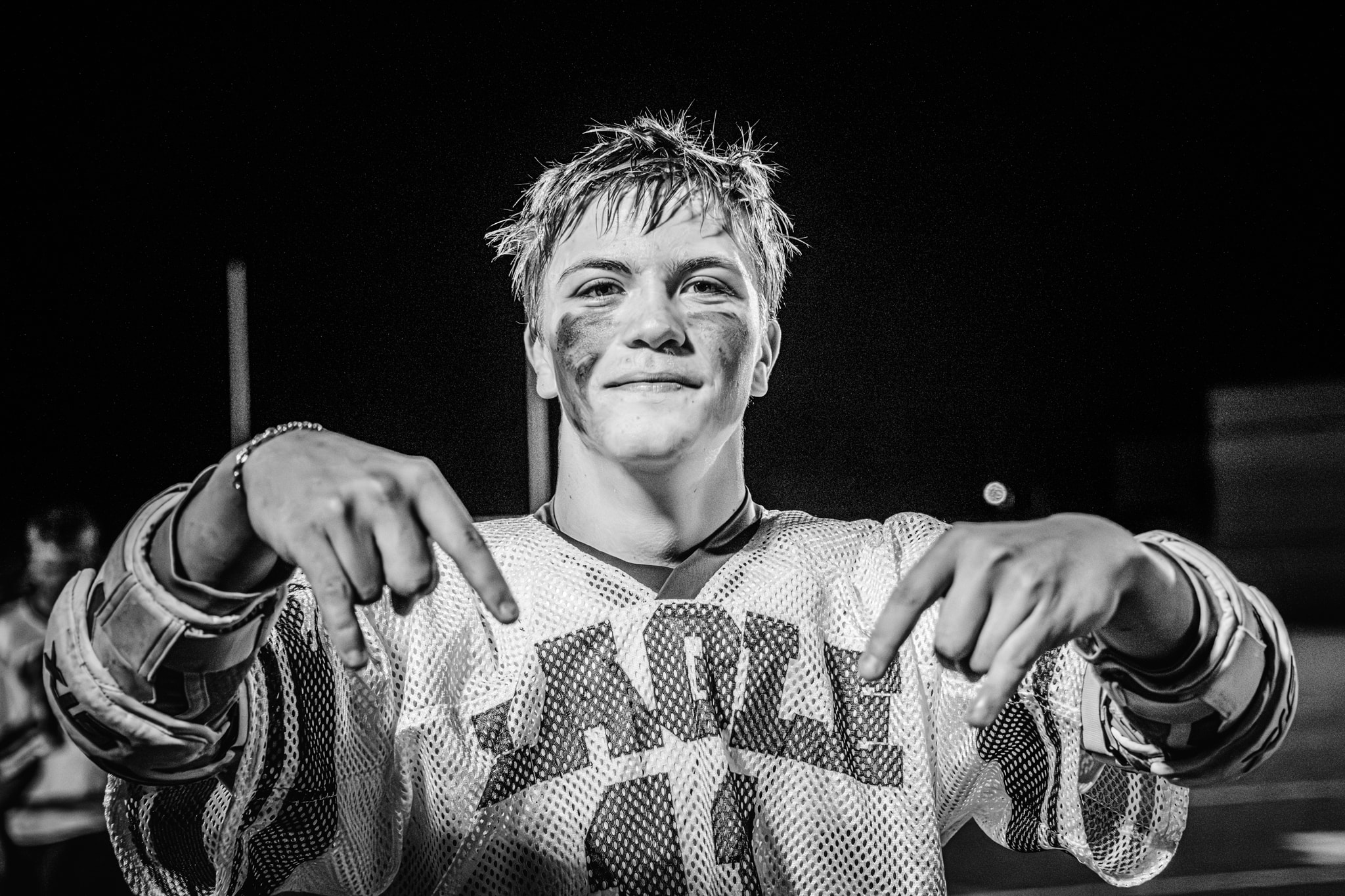 Young hockey player pointing at camera — individual athlete portrait Eagle Idaho