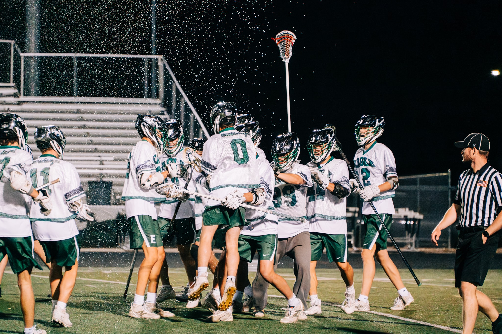 Lacrosse team celebrating night game victory — Treasure Valley league photography