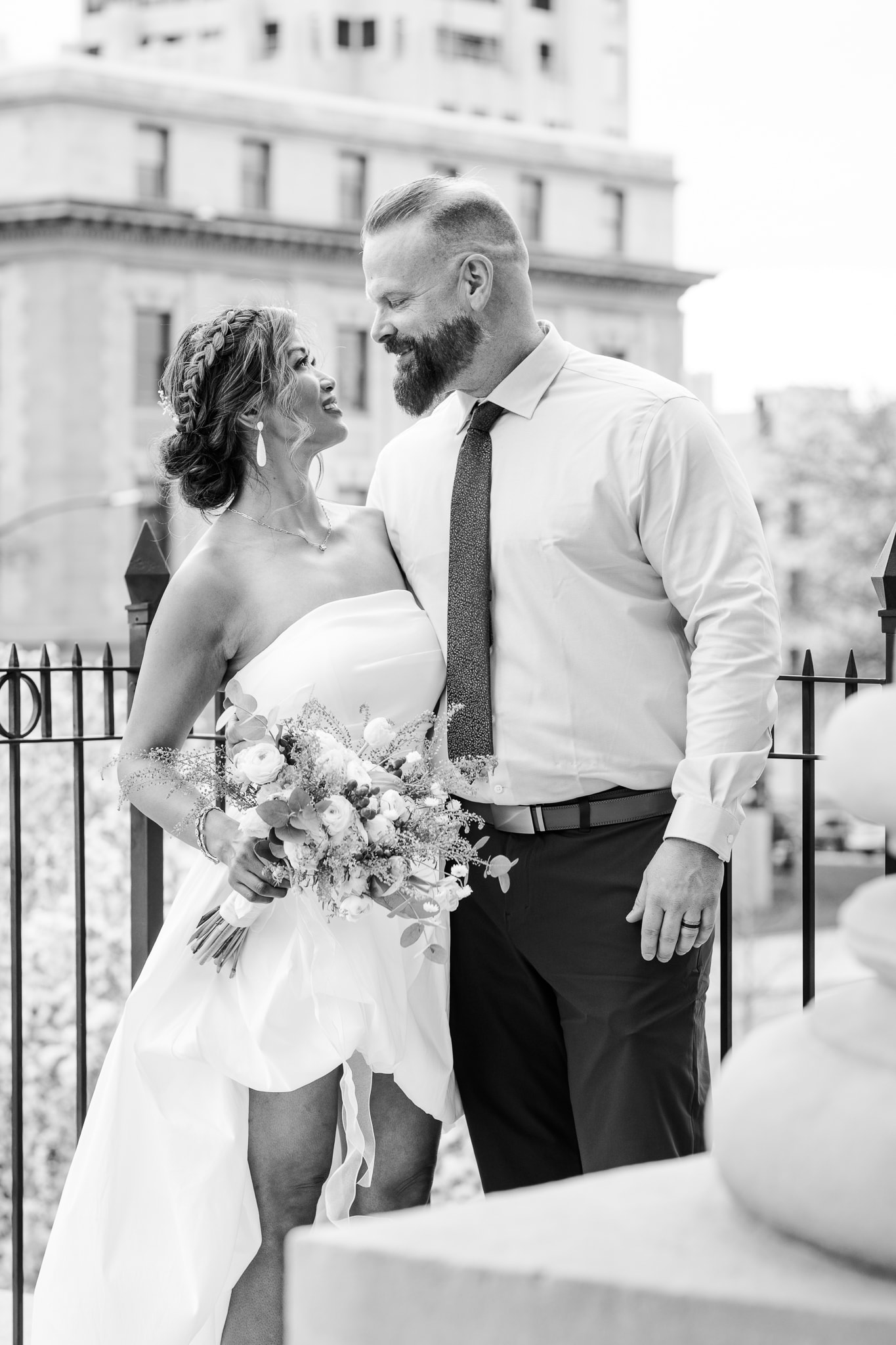 Bride and groom romantic moment on urban rooftop — Eagle Idaho wedding photographer