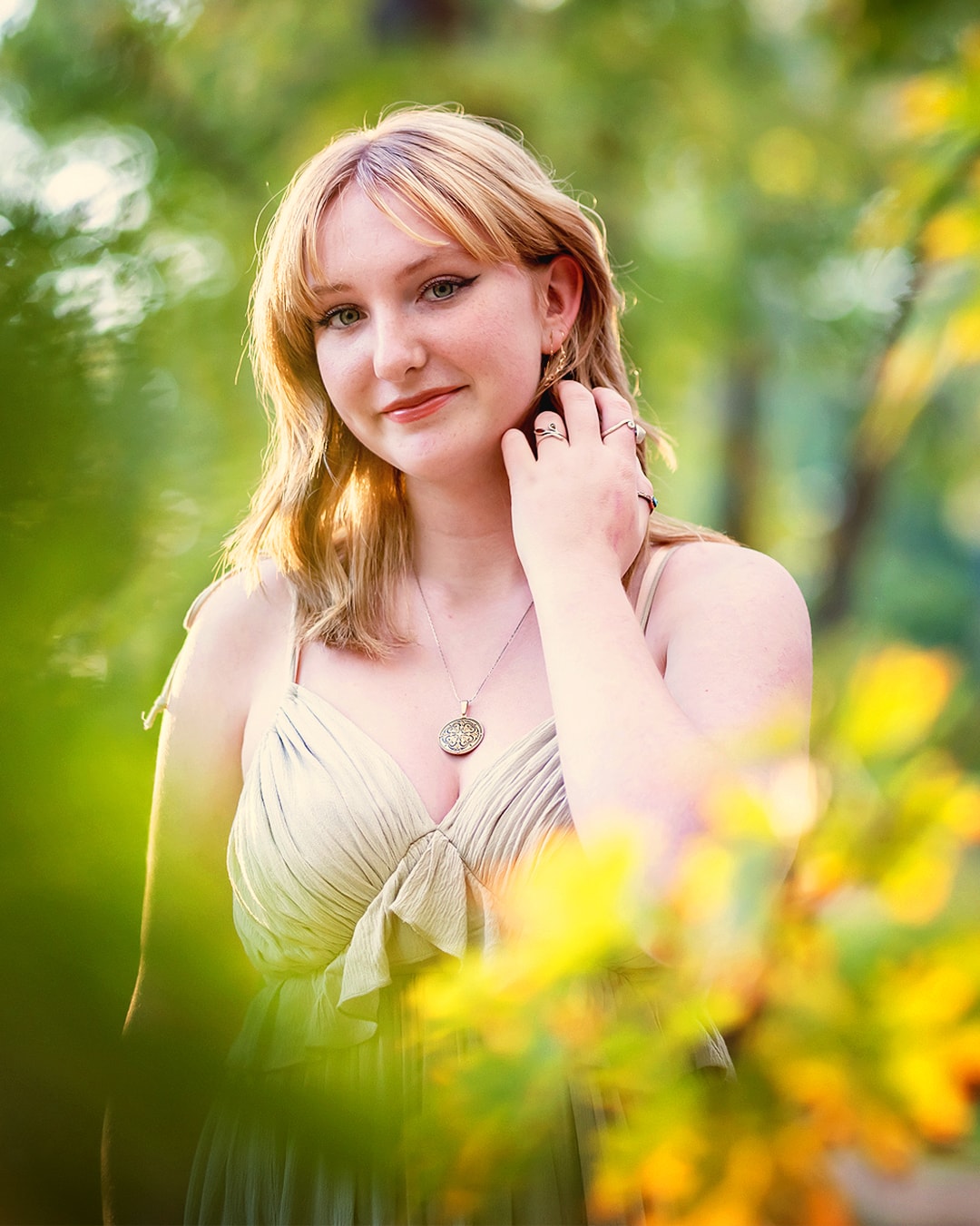 Senior portrait photographer Eagle Idaho — girl among yellow wildflowers