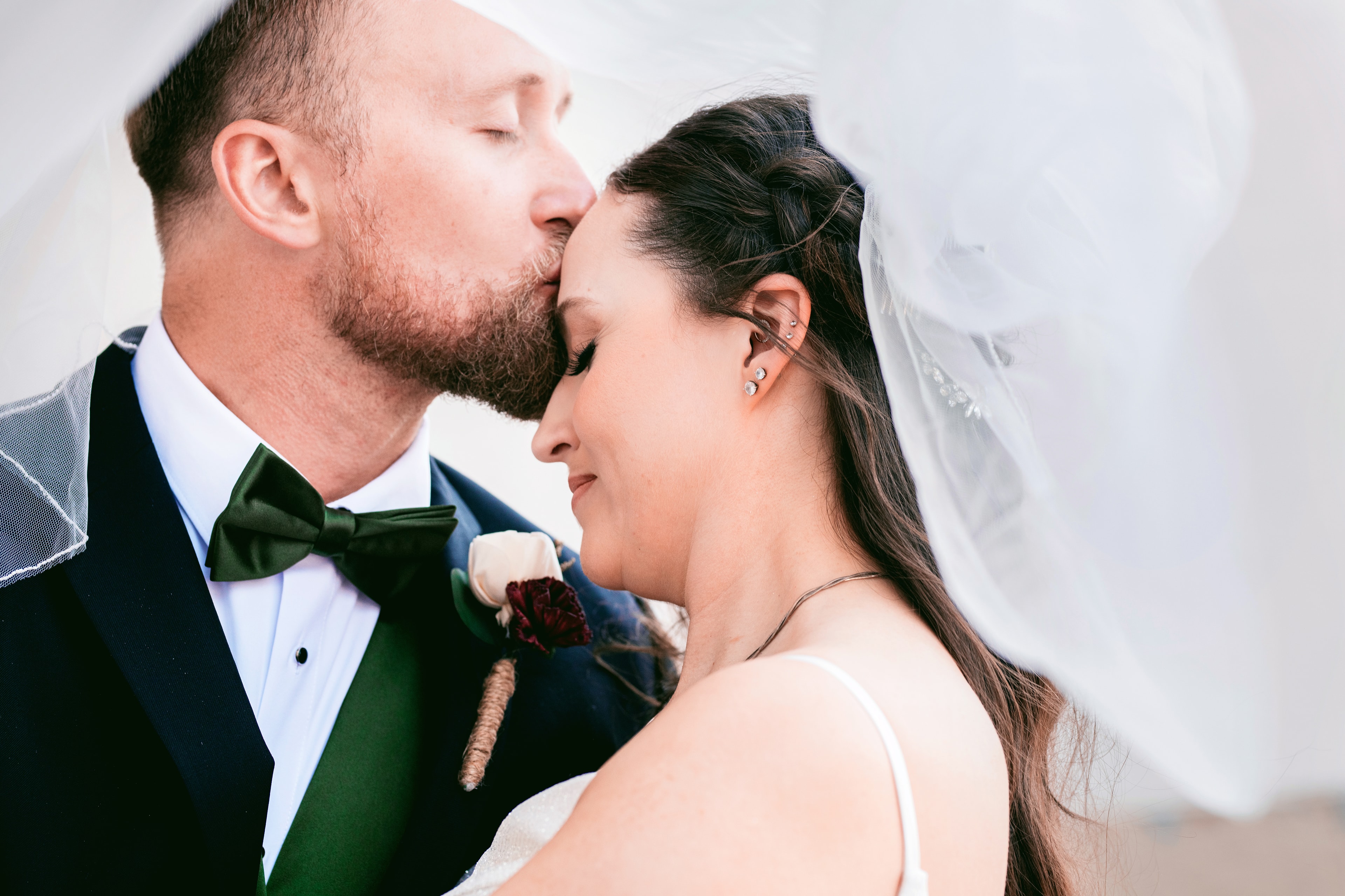Groom kissing bride on wedding day — Eagle Idaho wedding photography