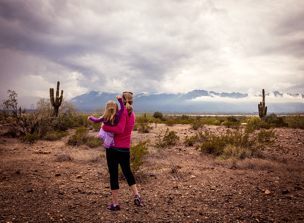 Mother and daughter watching clouds at South Mountain, Phoenix, Arizona